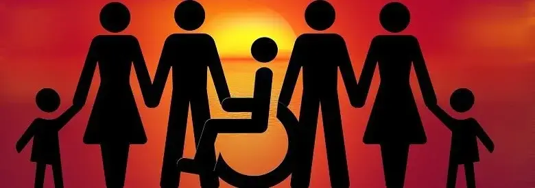 Silhouette of diverse family with wheelchair user at sunset, representing inclusion, support and community